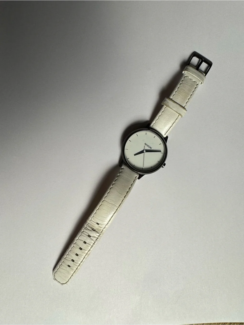 Nixon “Movin’ Out” Kensington analog watch with white leather band